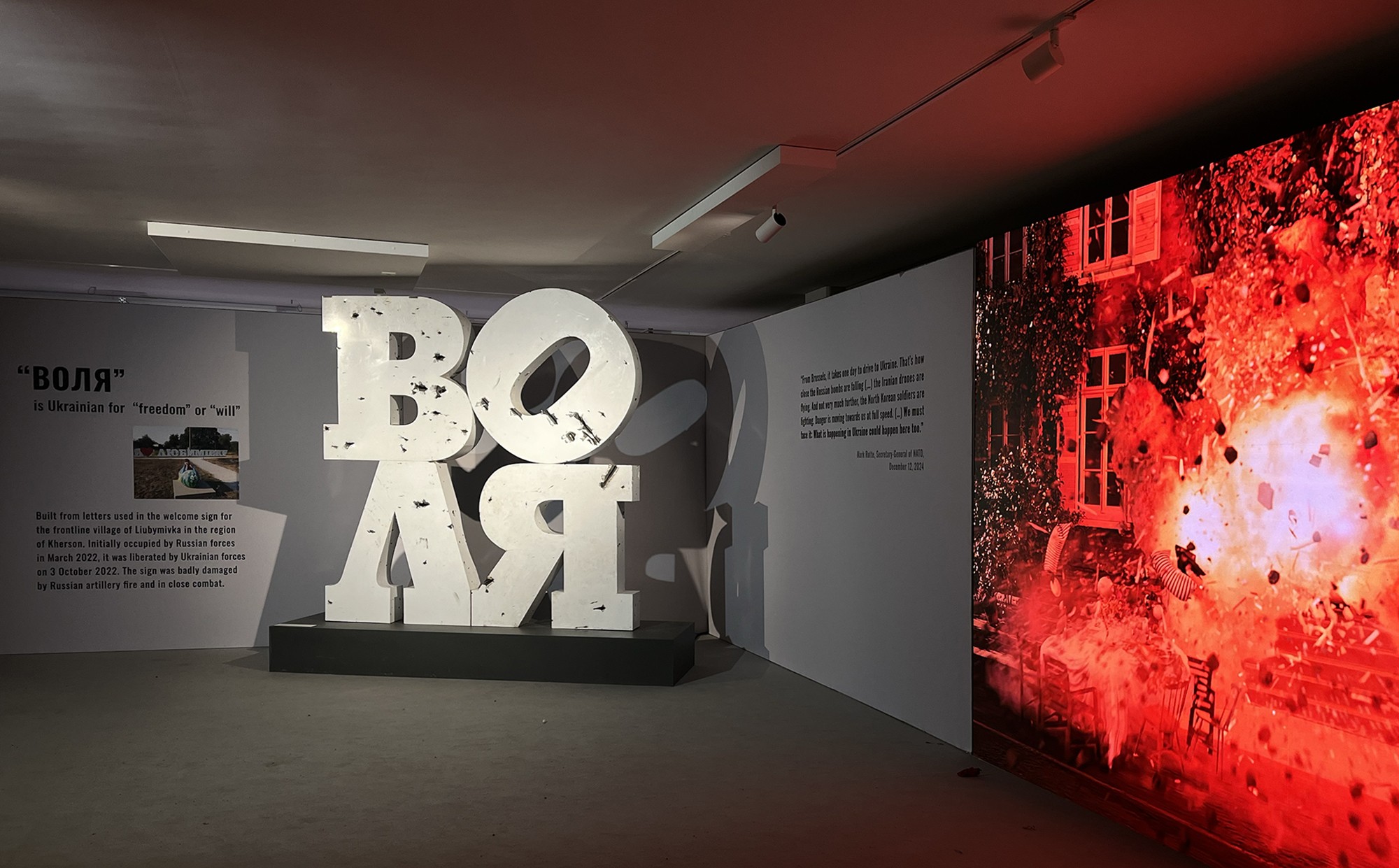 Volia . 2025, sculpture.  Plastic letters, metal, composite panels. 3 x 3.5 x 1m